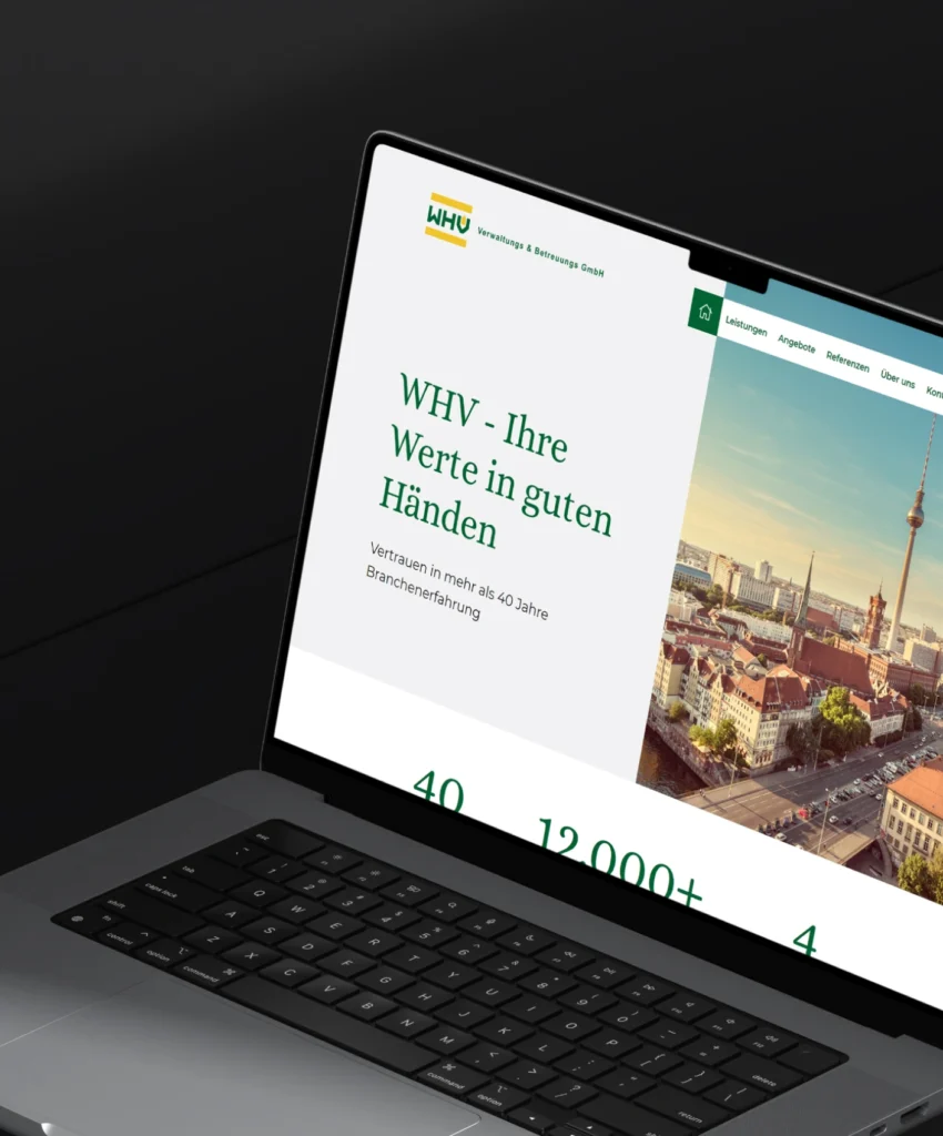 Laptopbildschirm mit Webseite von WHV Verwaltung & Betreuungs GmbH, Text: "WHV - Ihre Werte in guten Händen"